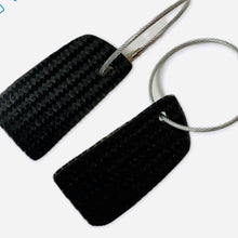 Load image into Gallery viewer, TF Sport Aston Martin Racing Team Le Mans Race Used Carbon Fibre Key Ring Set in a Presentation Box