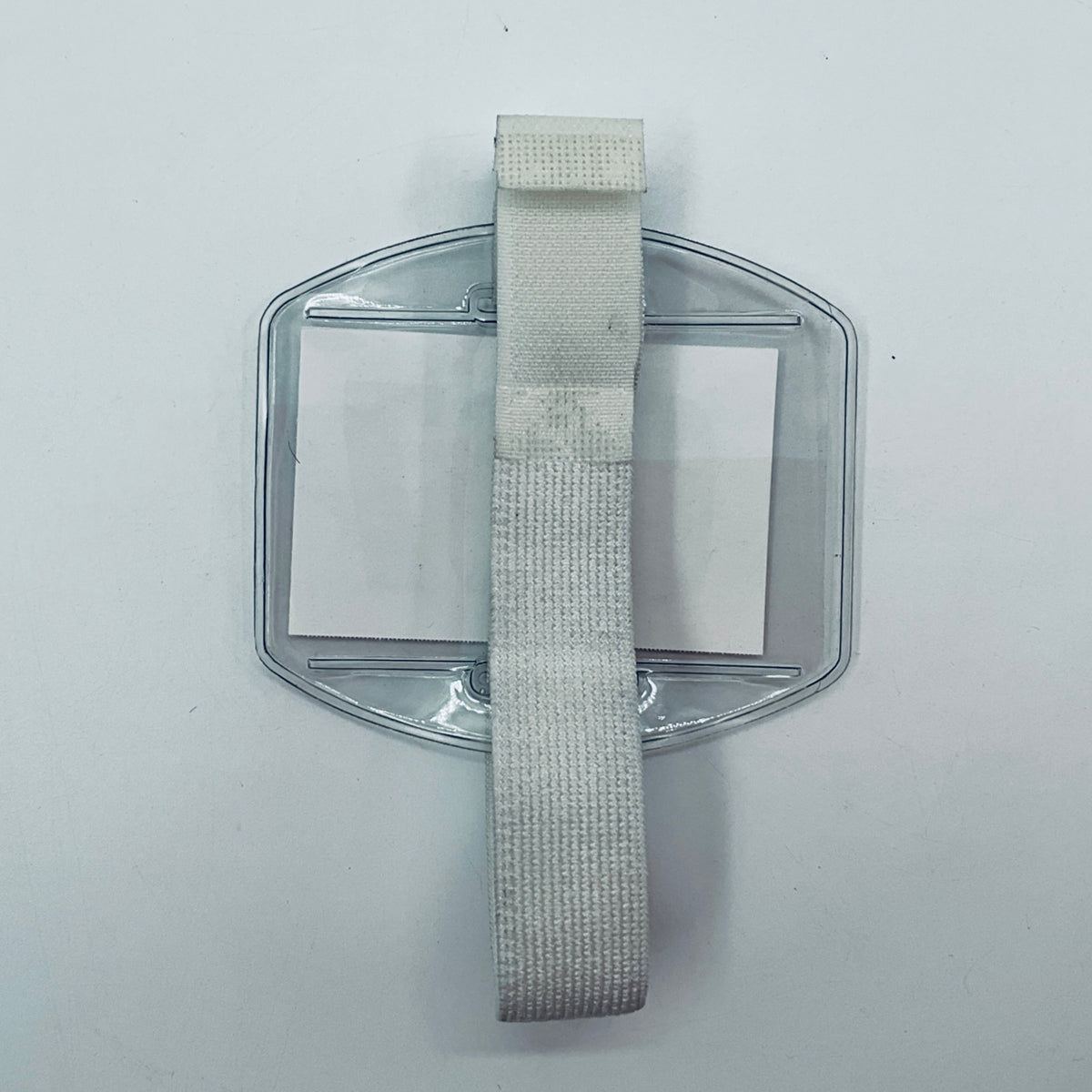 Clear plastic holder with a strap on a white background
