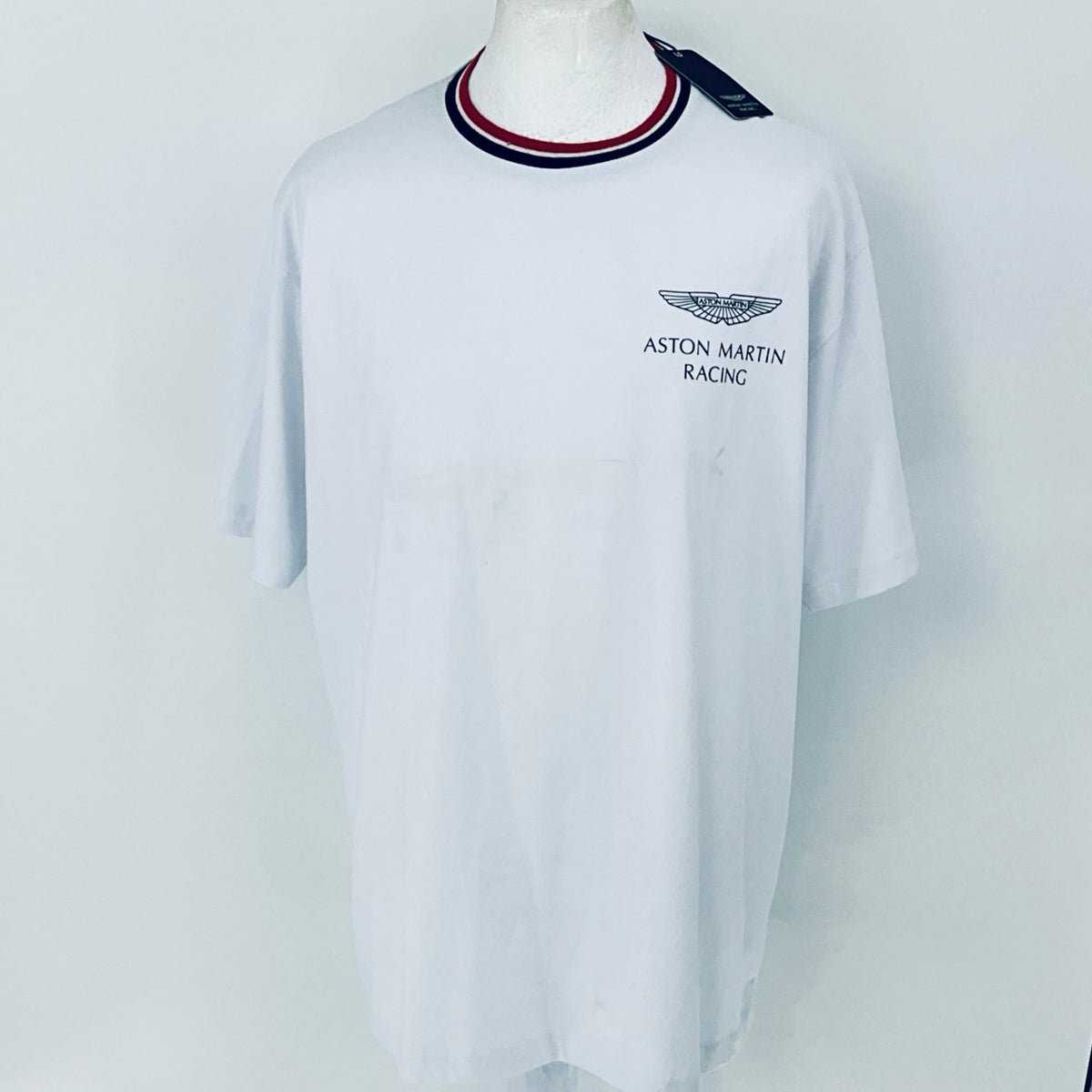 White t-shirt with Aston Martin Racing logo on a mannequin against a white background