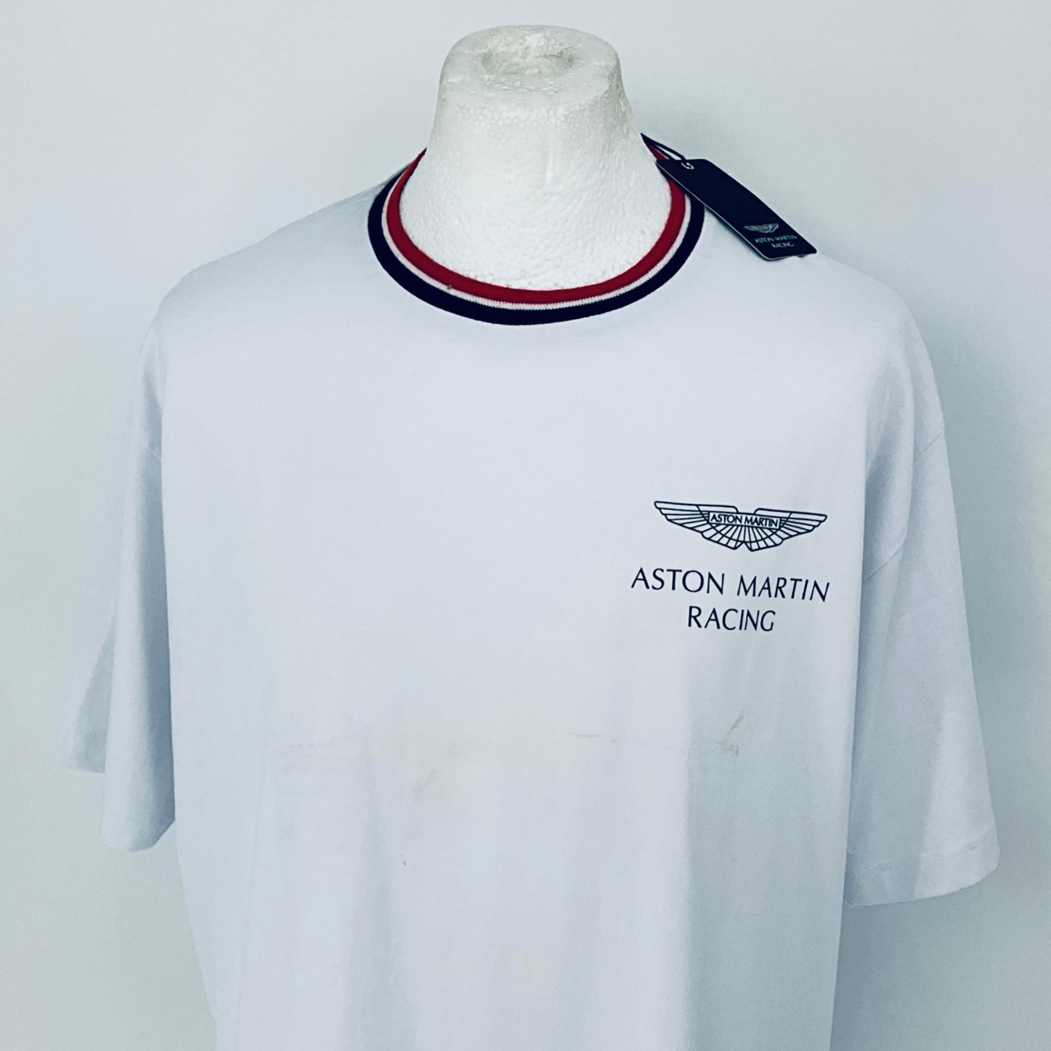 White t-shirt with Aston Martin Racing logo on a mannequin against a white background