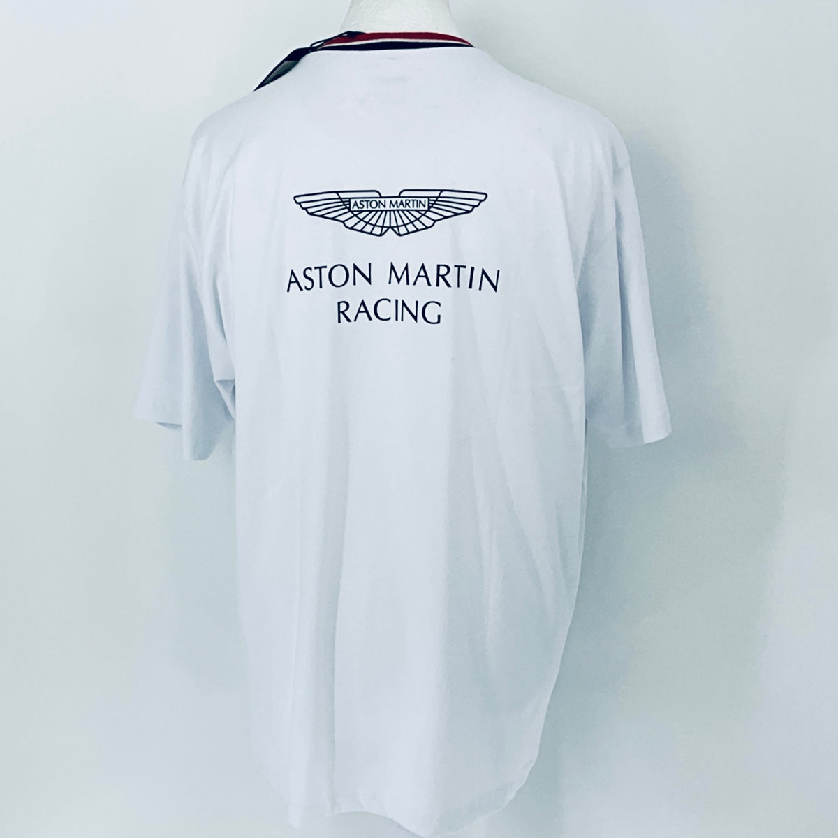 White t-shirt with Aston Martin Racing logo on a white background