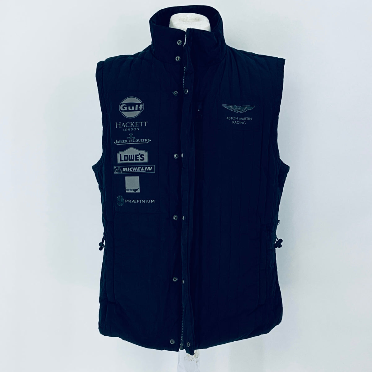 Navy blue vest with brand logos on a white background