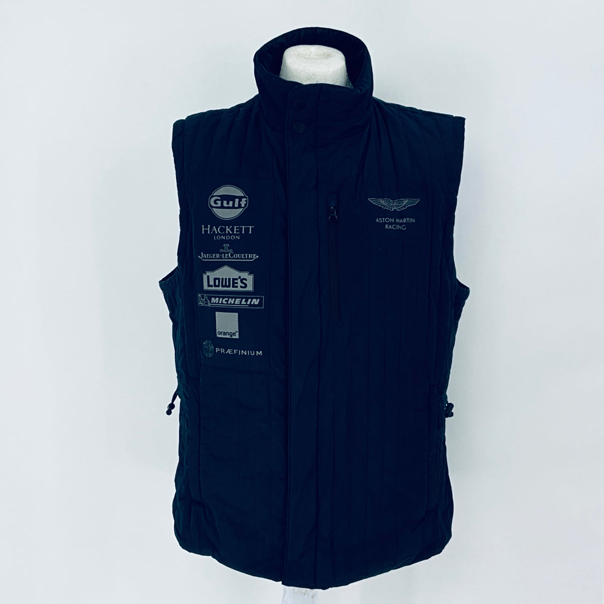 Navy blue vest with multiple brand logos on a white background