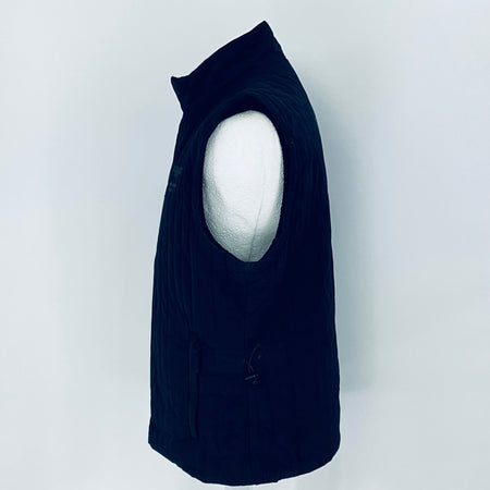 Black sleeveless jacket on a mannequin against a white background