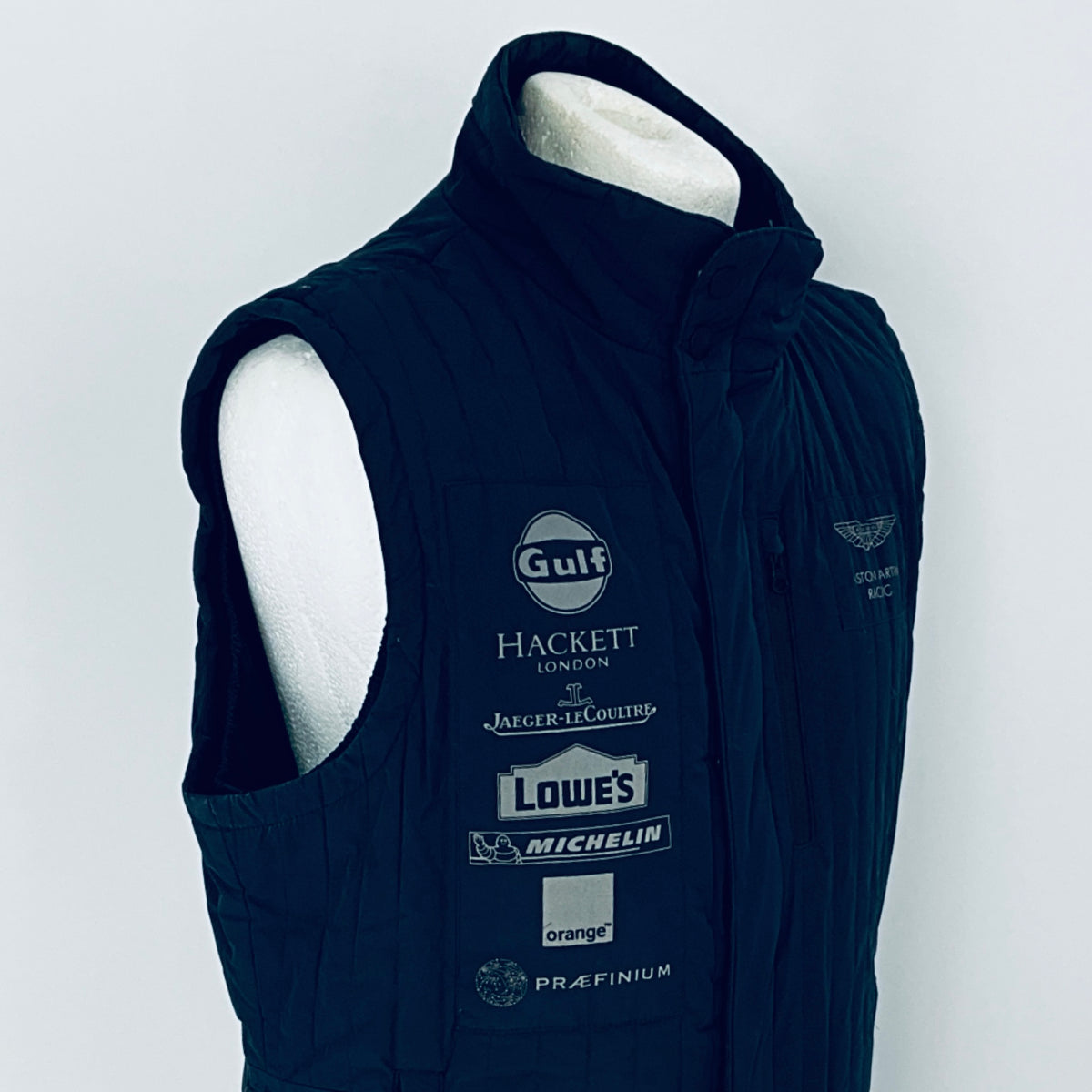 Navy blue vest with brand logos on a white background
