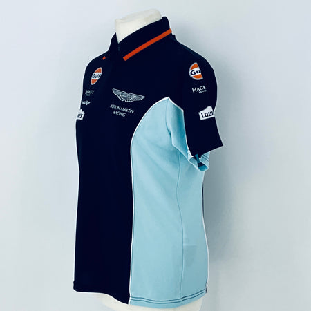 Two polo shirts on a mannequin with visible branding against a light gray background