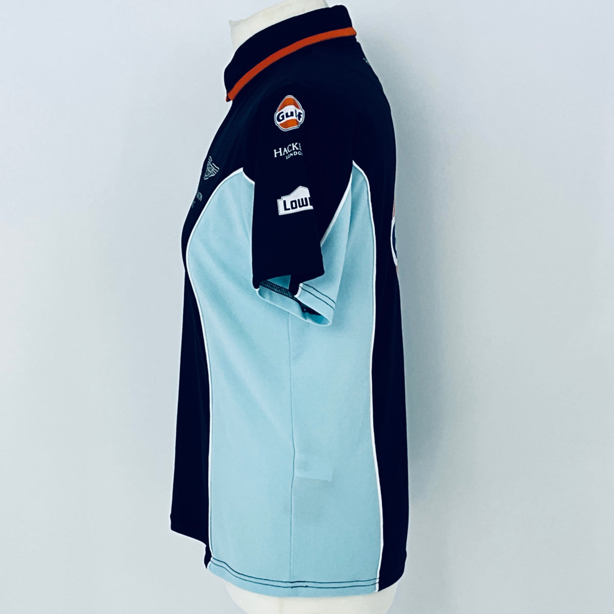 Navy and light blue sports jacket with brand logos on a white background