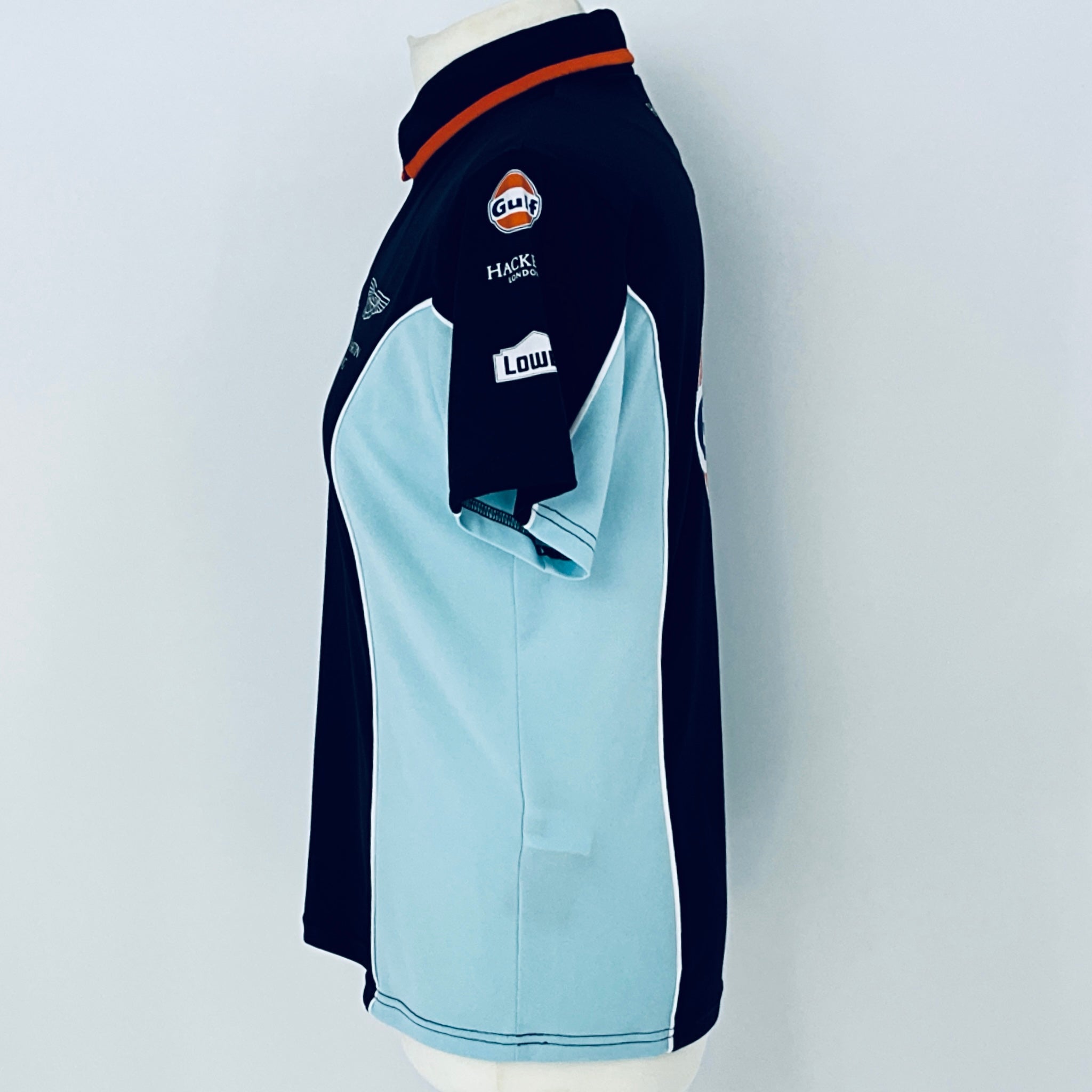 Navy and light blue sports jacket with brand logos on a white background