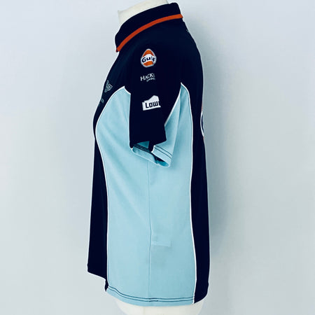 Navy and light blue sports jacket with brand logos on a white background