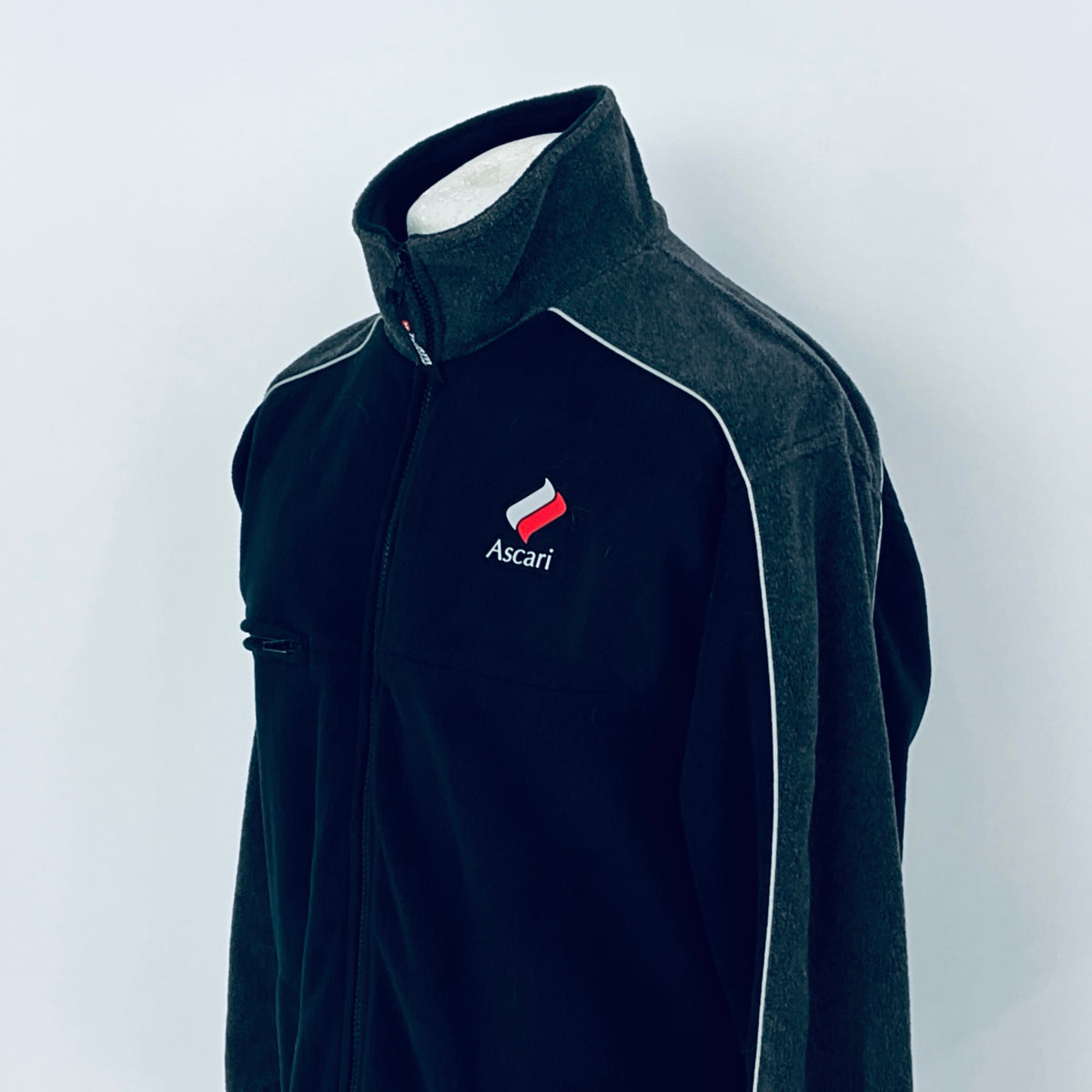 Black fleece jacket with Ascari logo on a white background