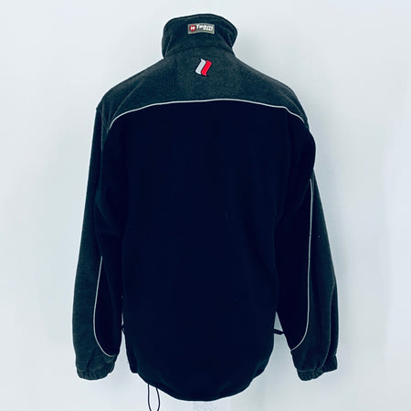 Black fleece jacket with a brand logo on the chest against a white background