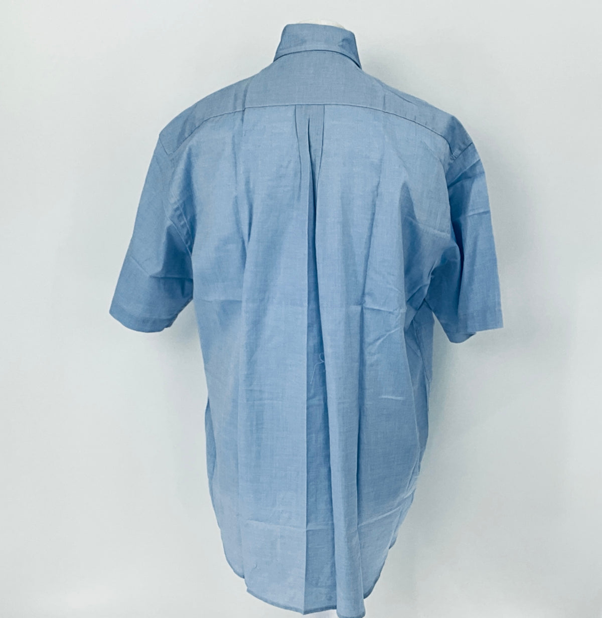 Light blue short-sleeve shirt on a white background