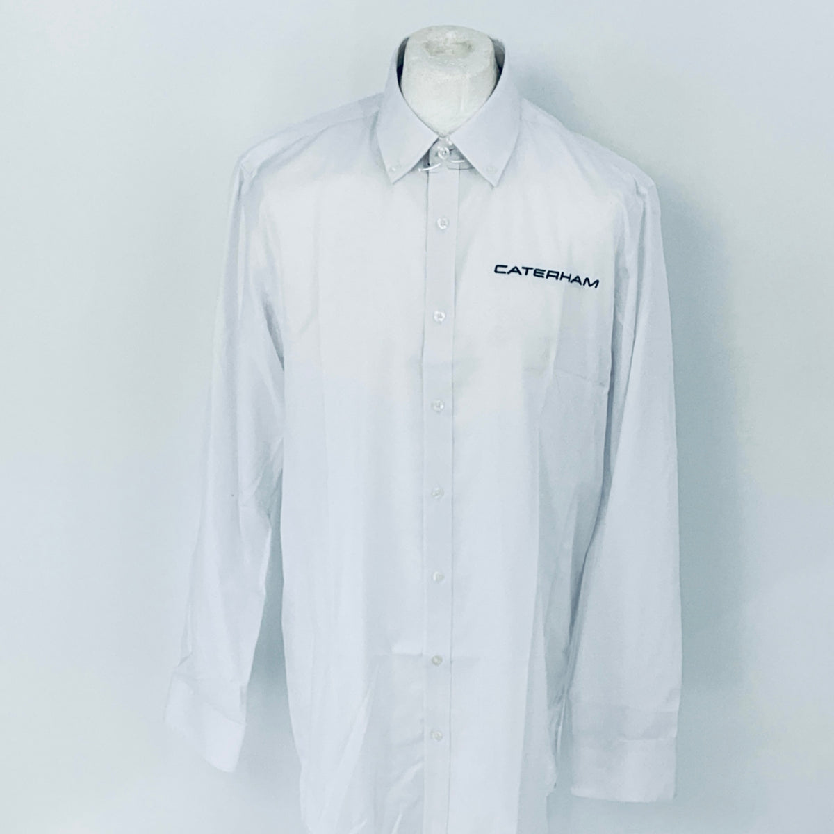 White shirt with 'Caterham' logo on a mannequin against a white background