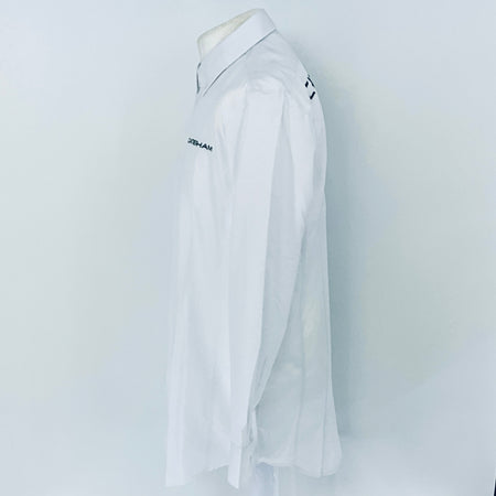 White shirt with brand logo on a mannequin against a white background