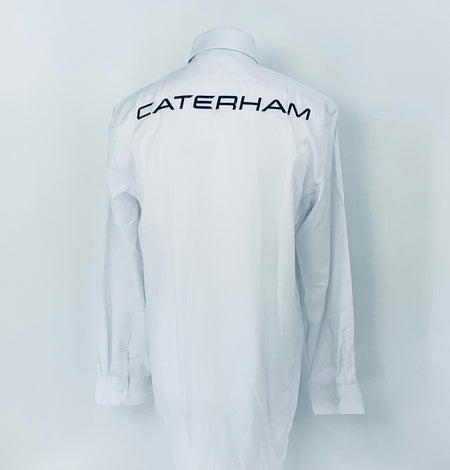 White shirt with 'Caterham' logo on the back against a white background