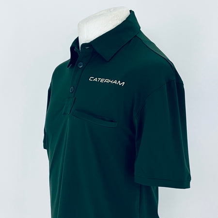 Green polo shirt with 'Caterham' logo on a mannequin against a white background