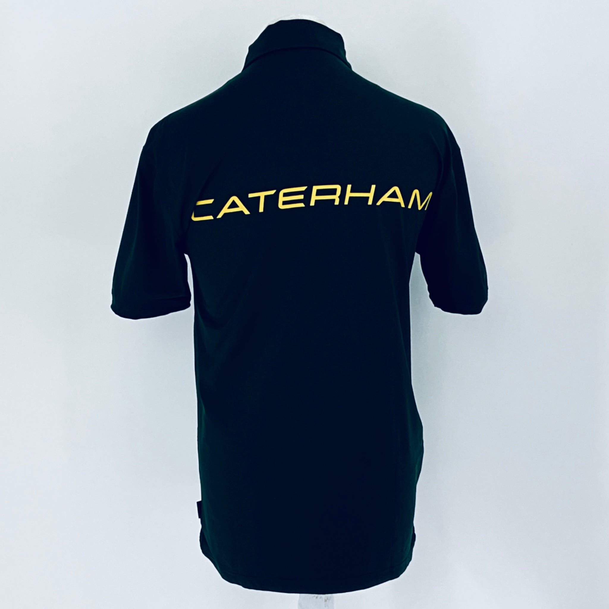 Black polo shirt with 'Caterham' logo on the back against a white background