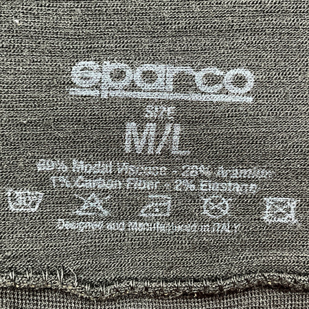 Close-up of a label on a fabric with 'Superio' branding and size information.