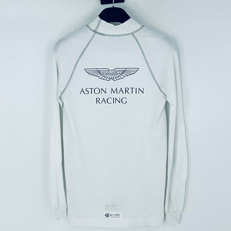 White long-sleeve shirt with Aston Martin Racing logo on a hanger against a white background