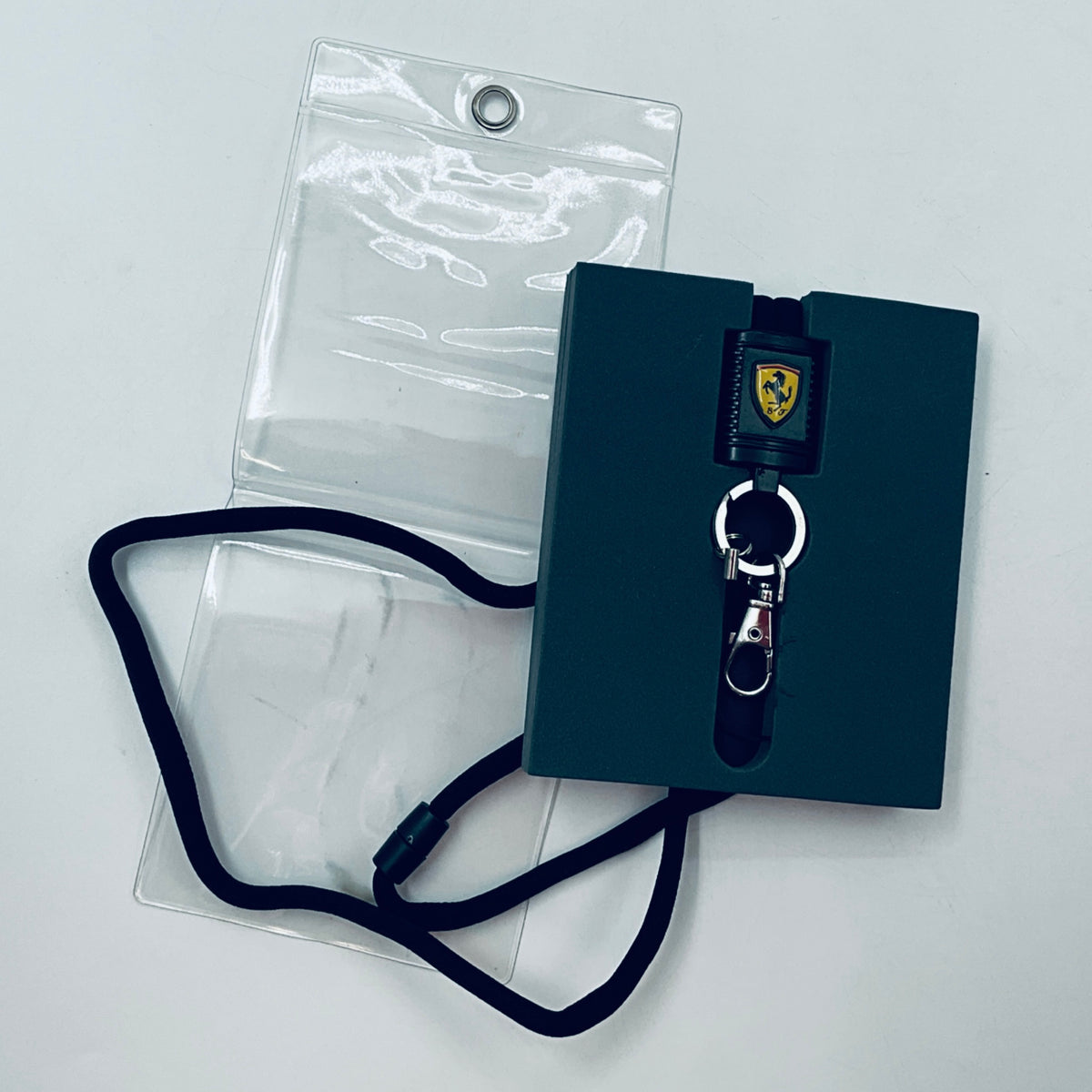 Scuderia Ferrari lanyard on card with clear bag sleeve and black strap key clip