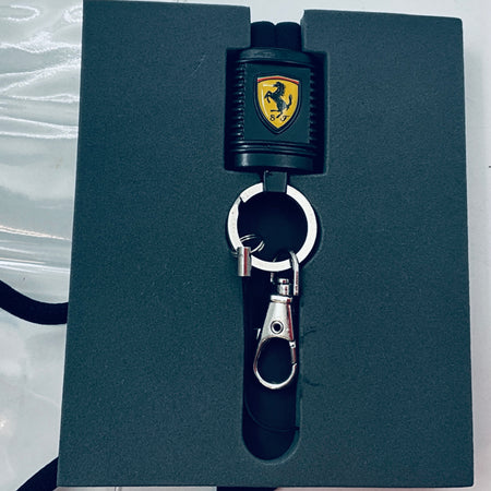 Scuderia Ferrari lanyard on dark card with black strap, shield connector, and key clip