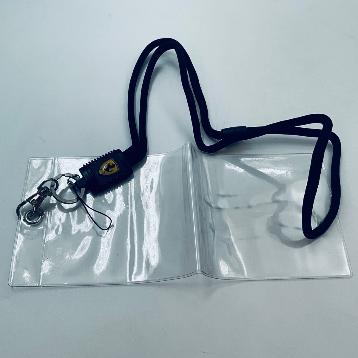 Scuderia Ferrari lanyard with black strap, shield connector, and metal keyring clip