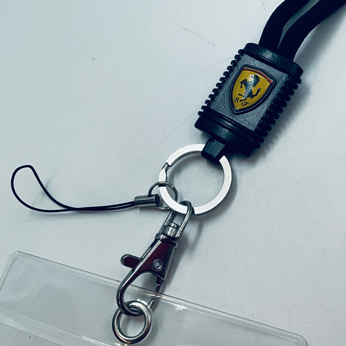 Scuderia Ferrari lanyard close-up with black connector and round metal keyring
