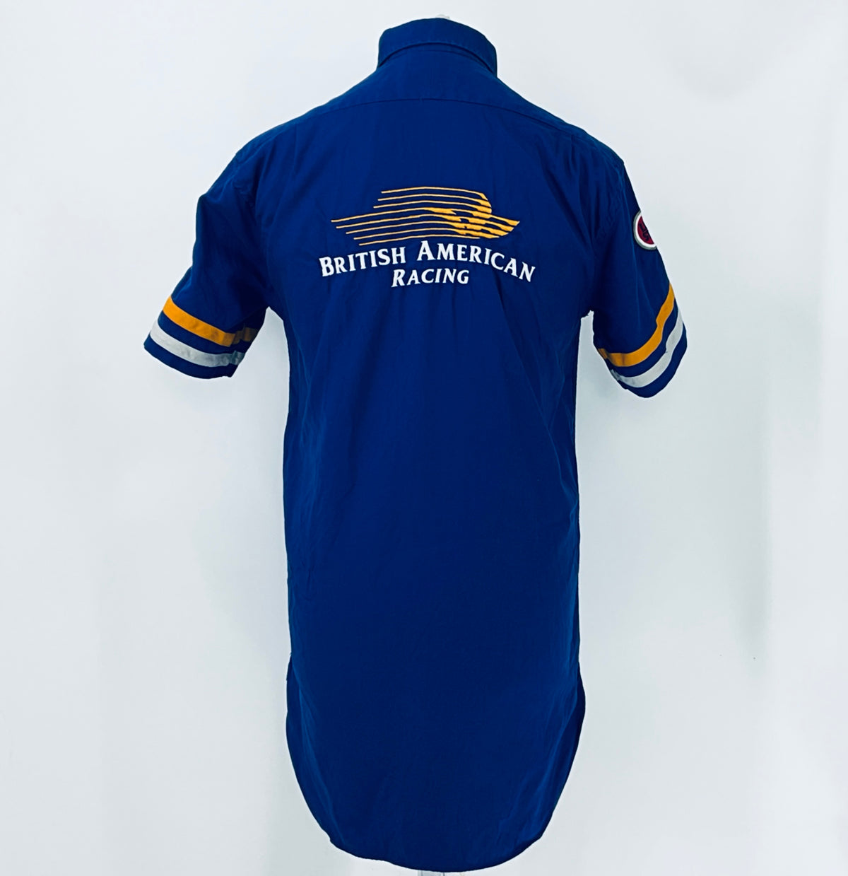 Blue short-sleeve button-up racing shirt back view with “British American Racing” logo