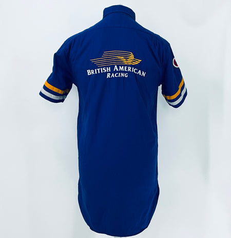 Blue short-sleeve button-up racing shirt back view with “British American Racing” logo