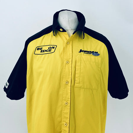 Two-tone short-sleeve button-up shirt, yellow front with navy sleeves and chest logo