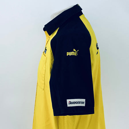 Two-tone short-sleeve button-up shirt, back-side view with navy sleeve panel and logo