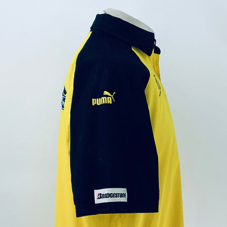 Two-tone short-sleeve button-up shirt, side view showing Puma logo on navy sleeve