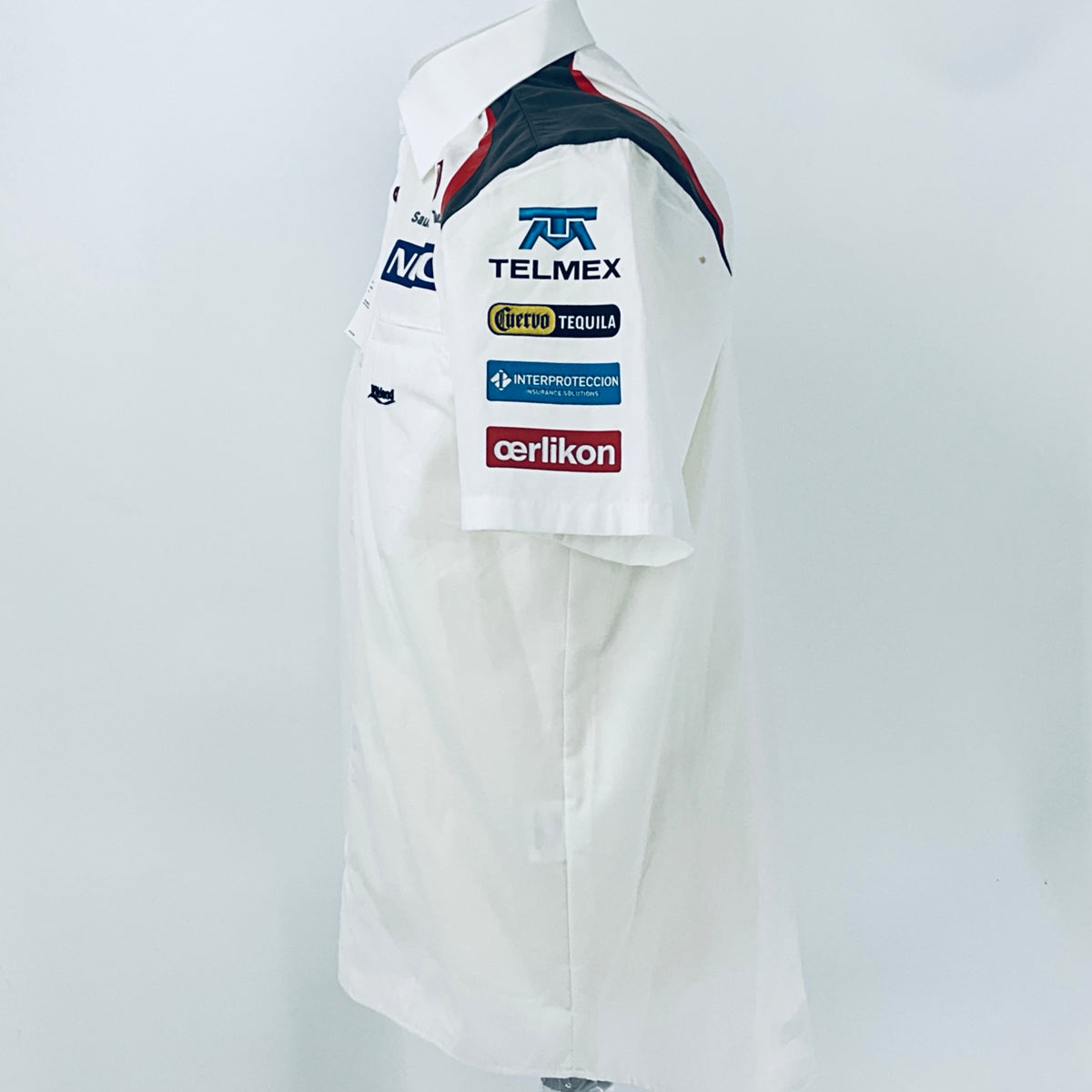 White racing shirt back/side view with TELMEX sponsor and team logos