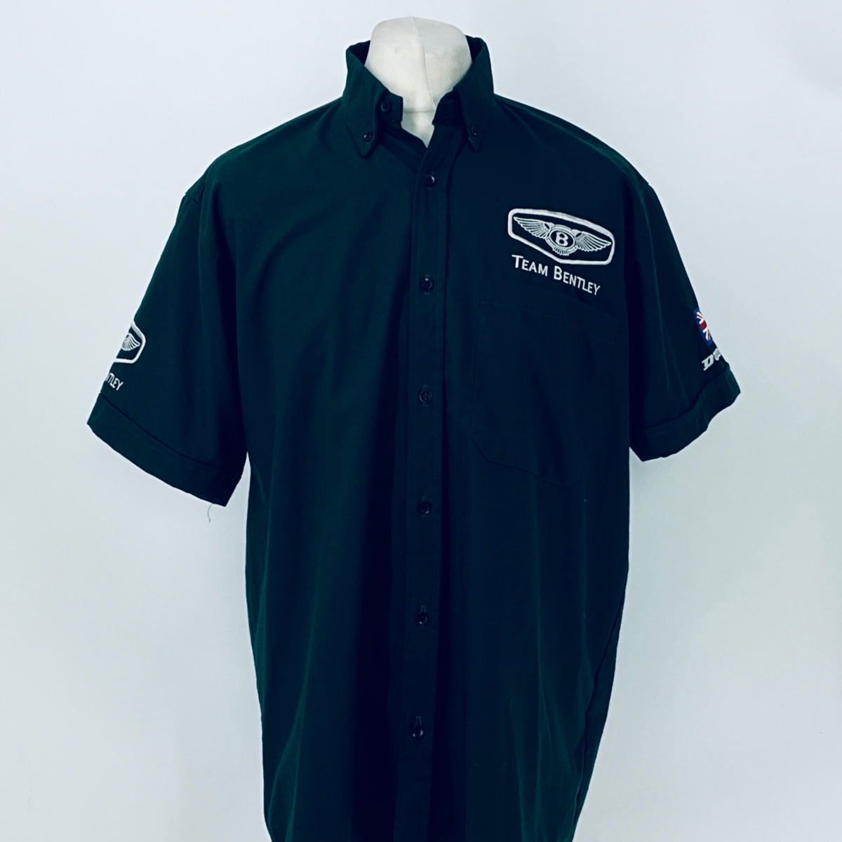 Dark teal button-front polo shirt with Team Bentley chest logo