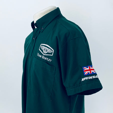 Dark teal polo shirt with Team Bentley logo patch and Union Jack sleeve graphic