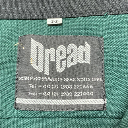 Teal fabric garment with gray Bentley clothing label
