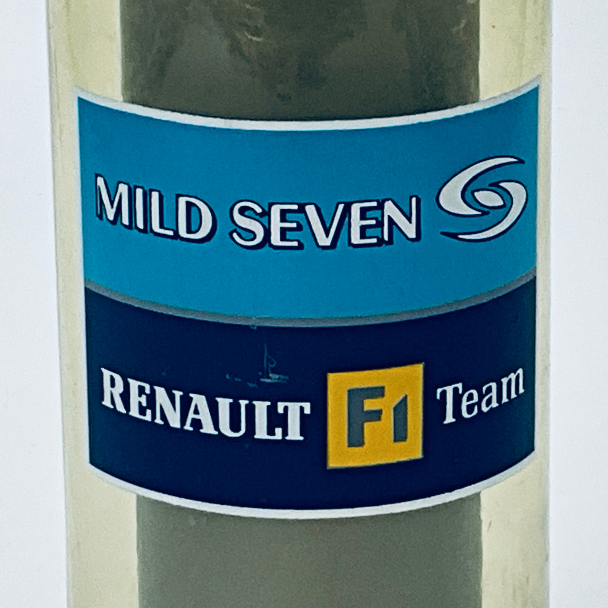 Close-up of racing logo label: MILD SEVEN and RENAULT F1 Team on bottle