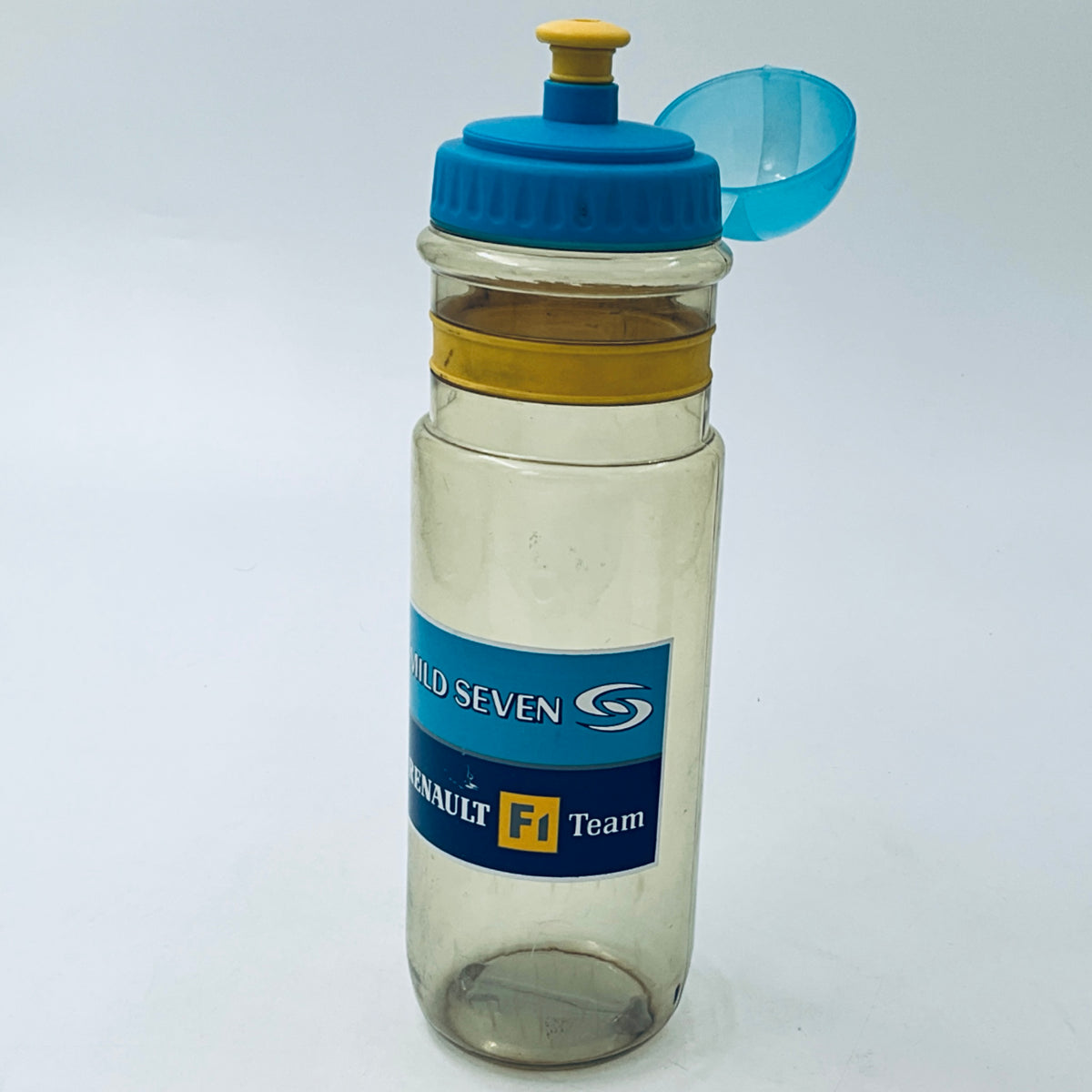 Clear plastic bottle with blue cap and yellow ring, showing MILD SEVEN logo