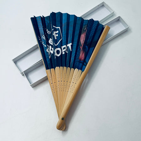 Blue printed folding fan with wooden handle, packaged in a slim gray gift box