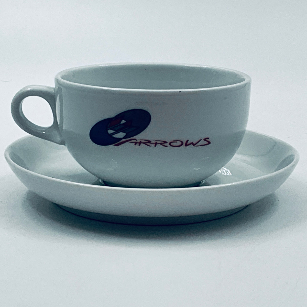 Light blue porcelain cup with handle and saucer, ARROWS logo on side