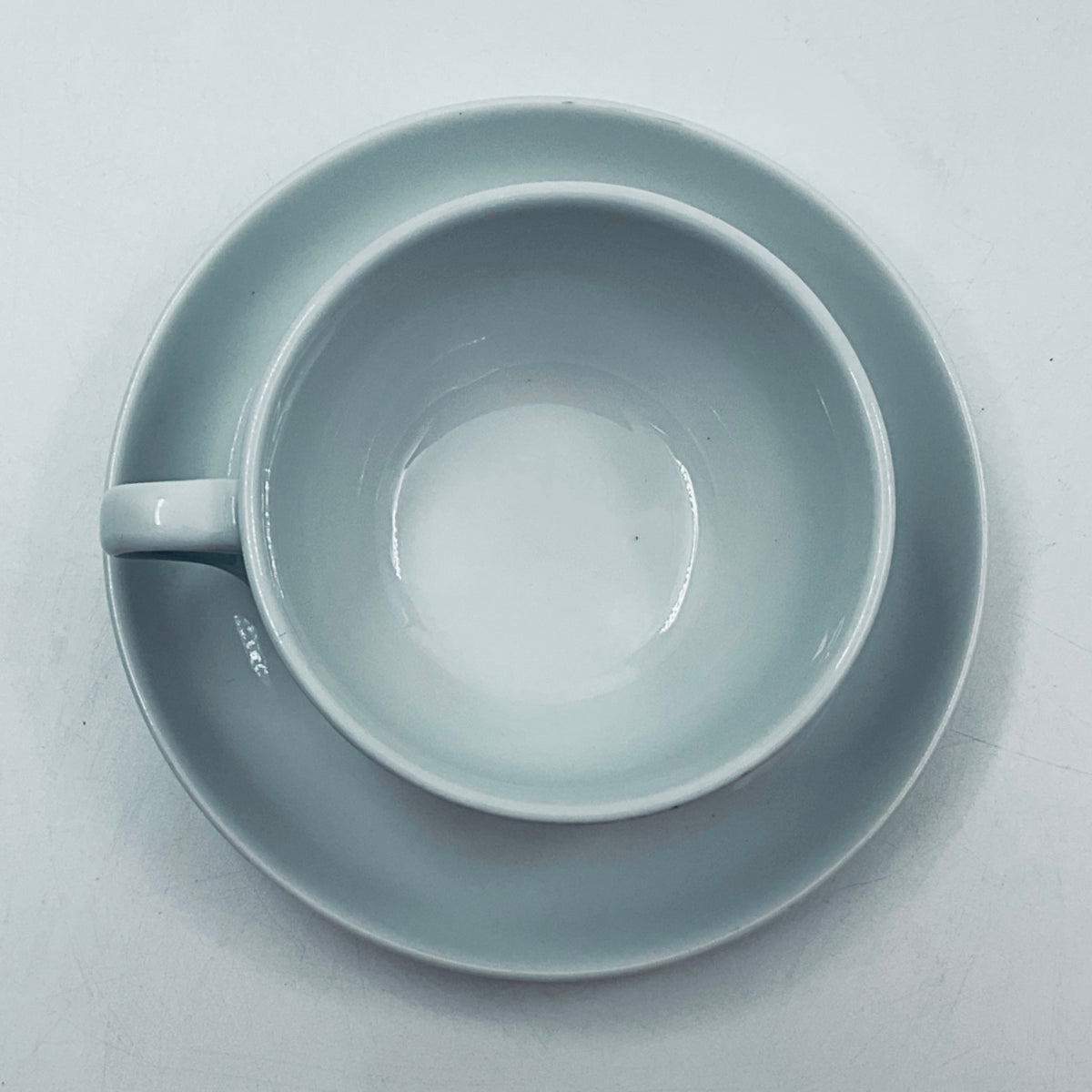 Light blue porcelain cup from above, open rim and interior