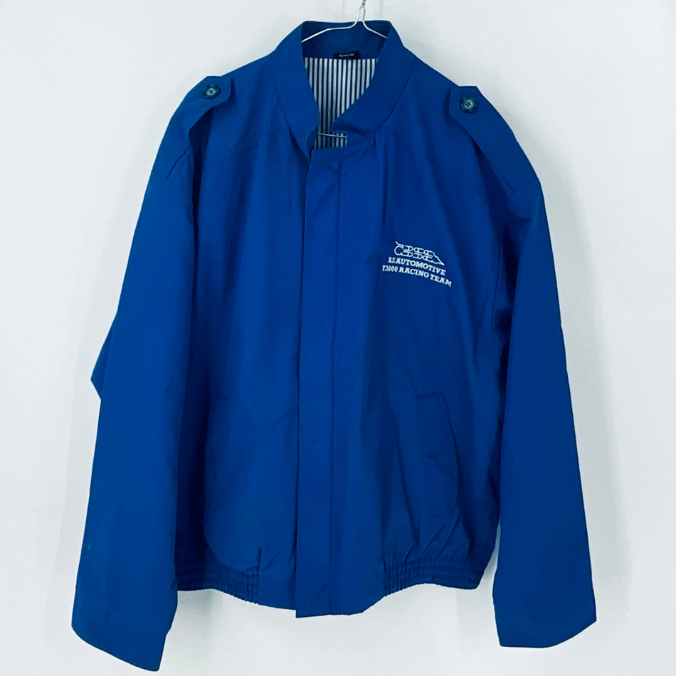 Blue crew bomber jacket with stand collar, front zipper, and racing team chest logo