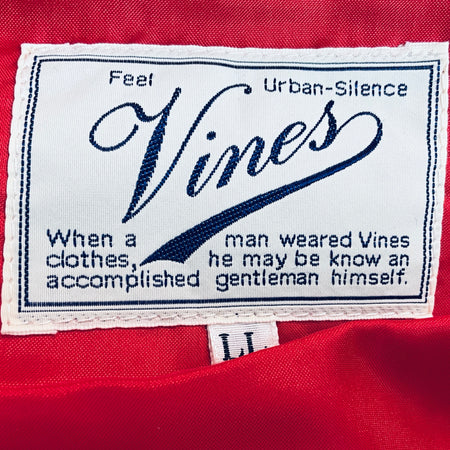 Red jacket lining with Vines label and blue decorative text patch