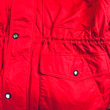 Red winter jacket with buttoned flap pockets and quilted midsection
