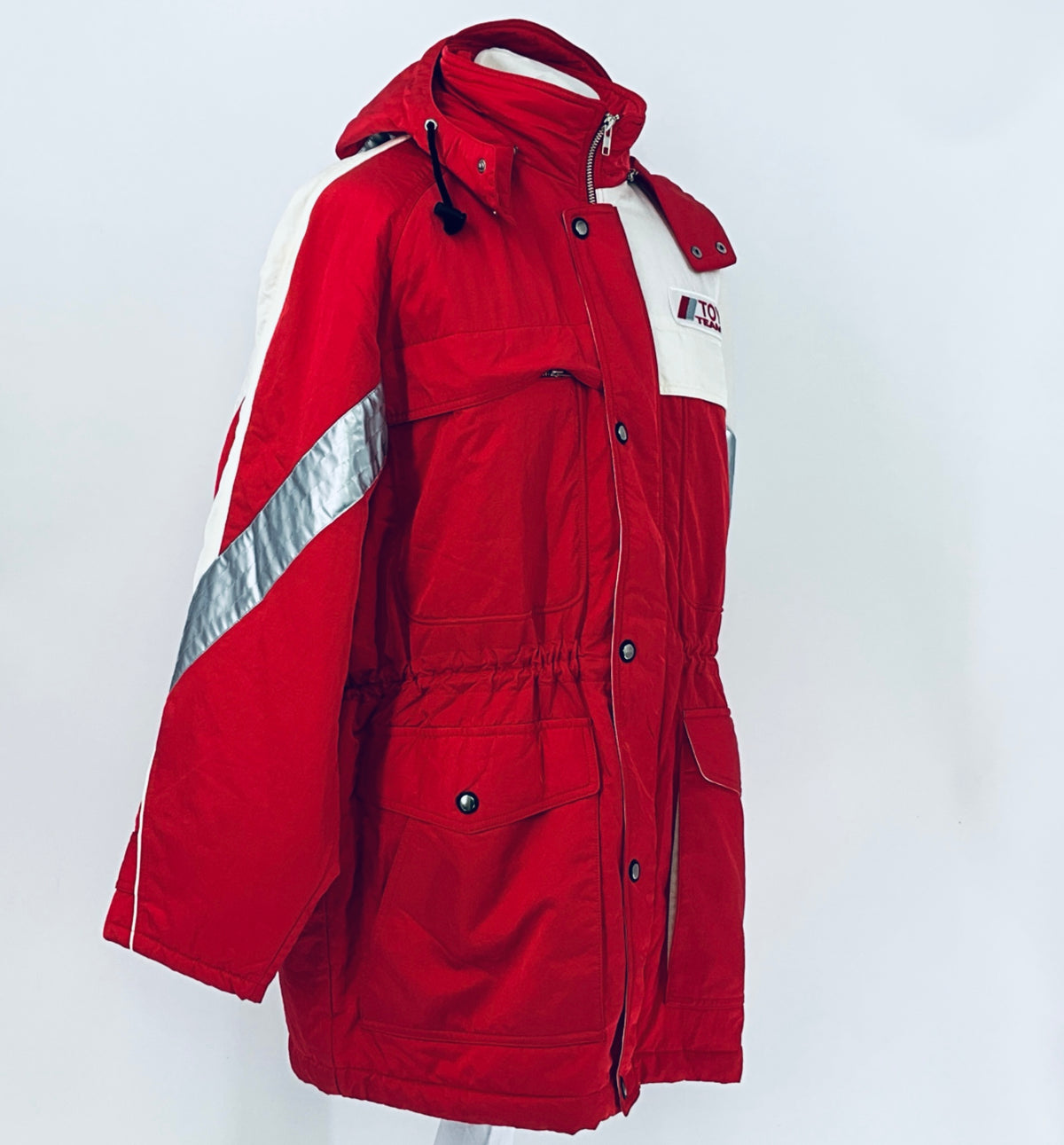 Red winter jacket with hood, white stripe panels, snap buttons and front zipper