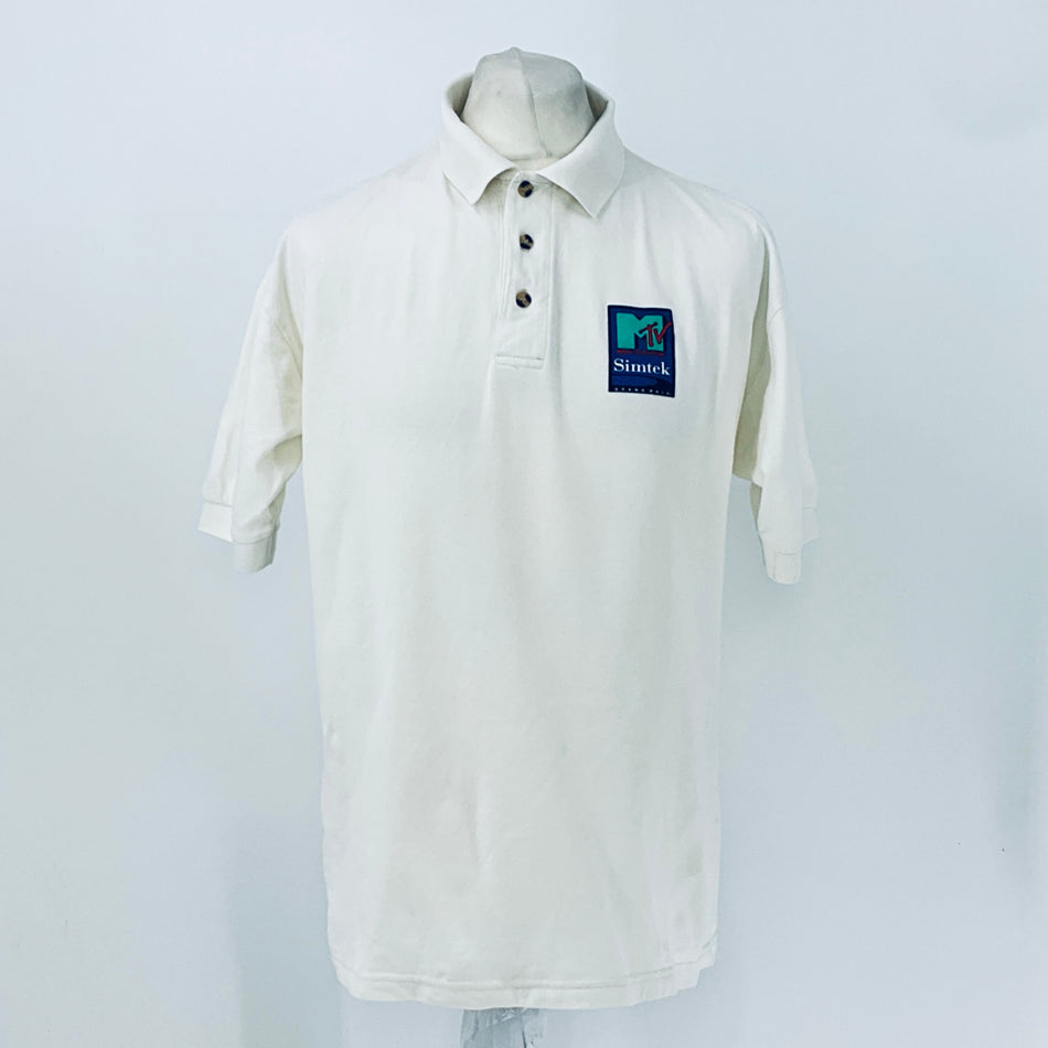 White polo shirt with button placket, collar, and Simtek logo patch on chest