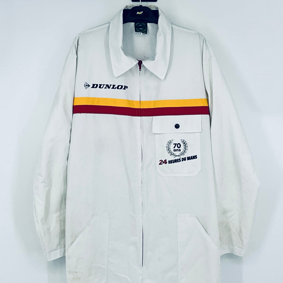 White coveralls with open collar, DUNLOP logo, and 70th anniversary chest patch