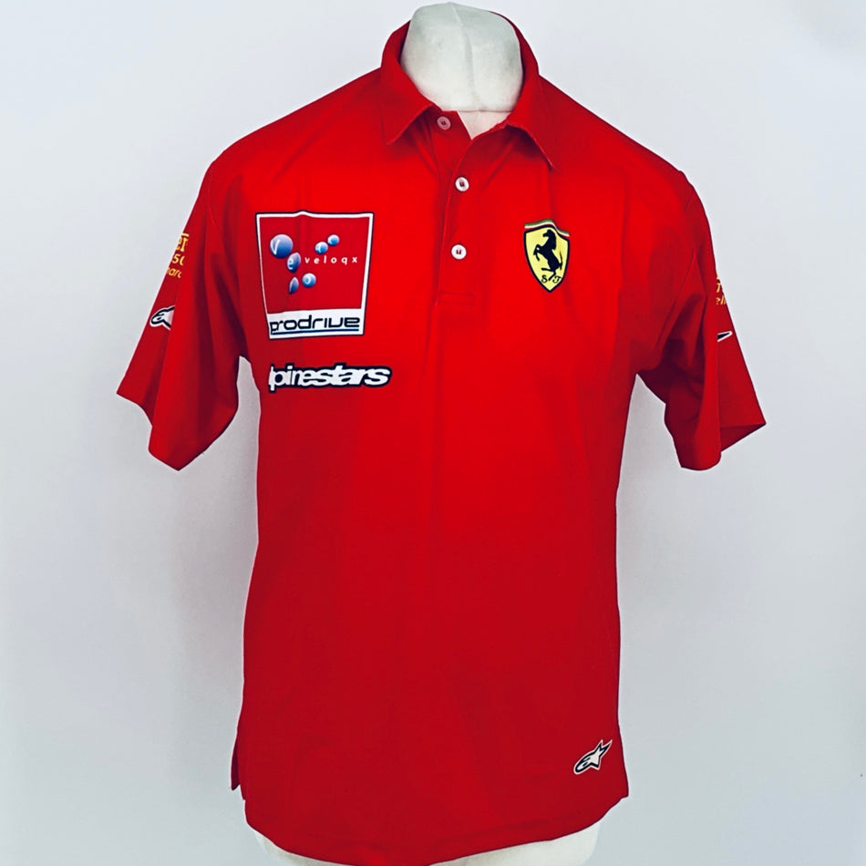 Red polo shirt with button collar, front Ferrari shield and Prodrive logo panel