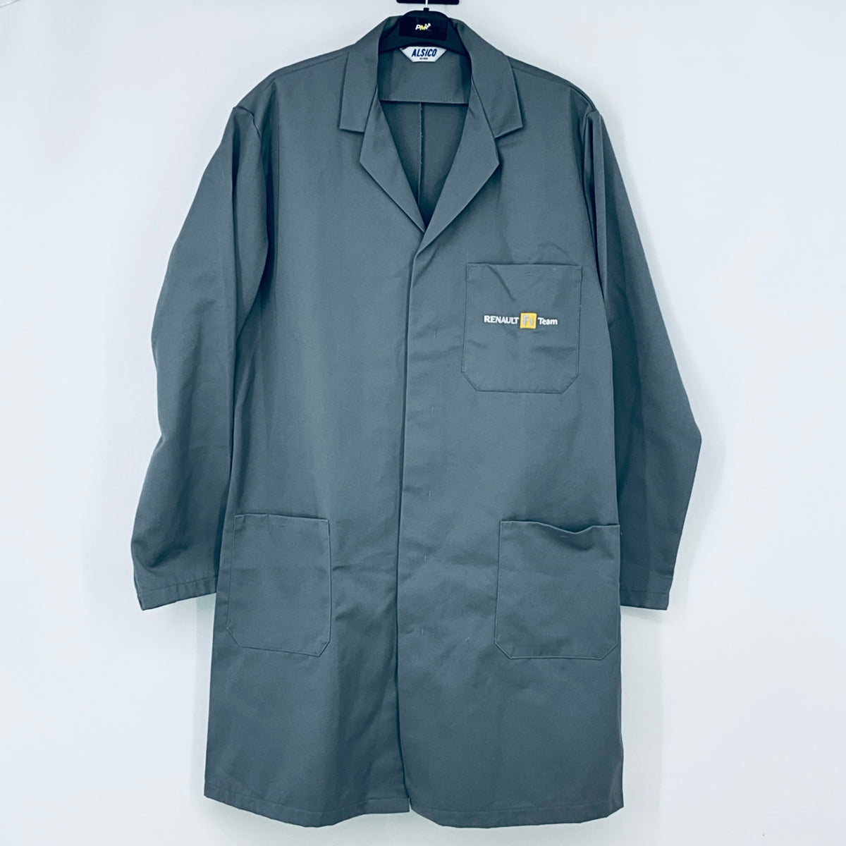 Teal workwear coat with lapels, button front, and chest logo patch