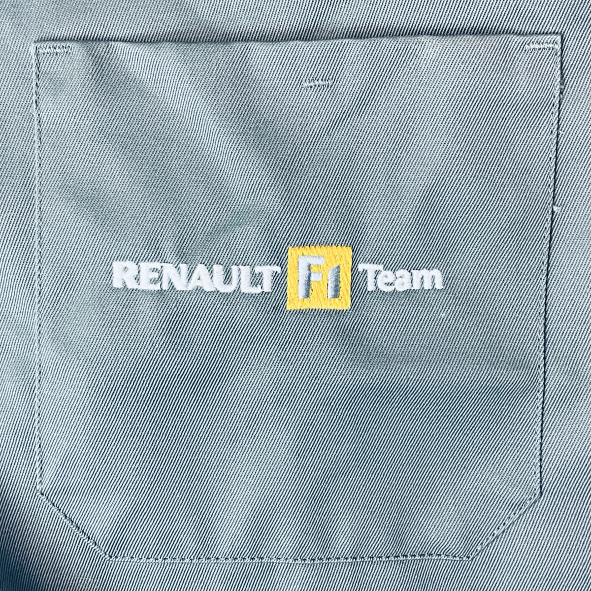 Renault F1 Team logo patch on teal chest pocket of workwear coat
